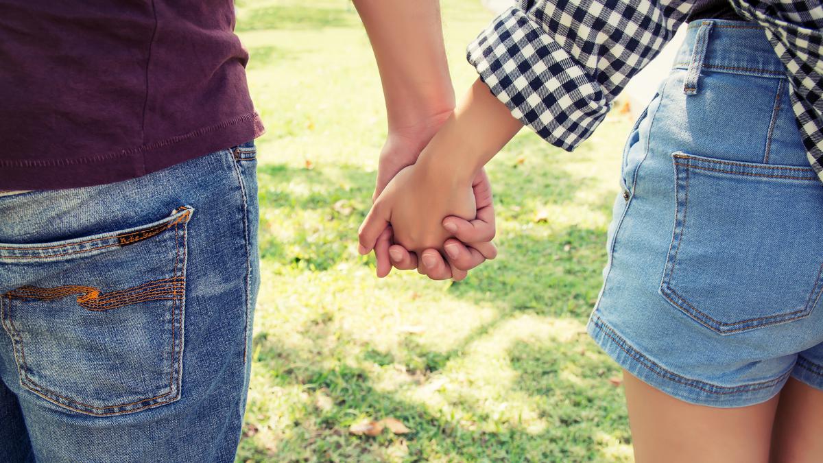 067628900_1749804979-close-up-couple-holding-hands-outdoors.jpg